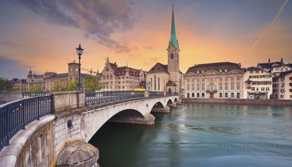 Colorful sunset behind the Zurich cityscape